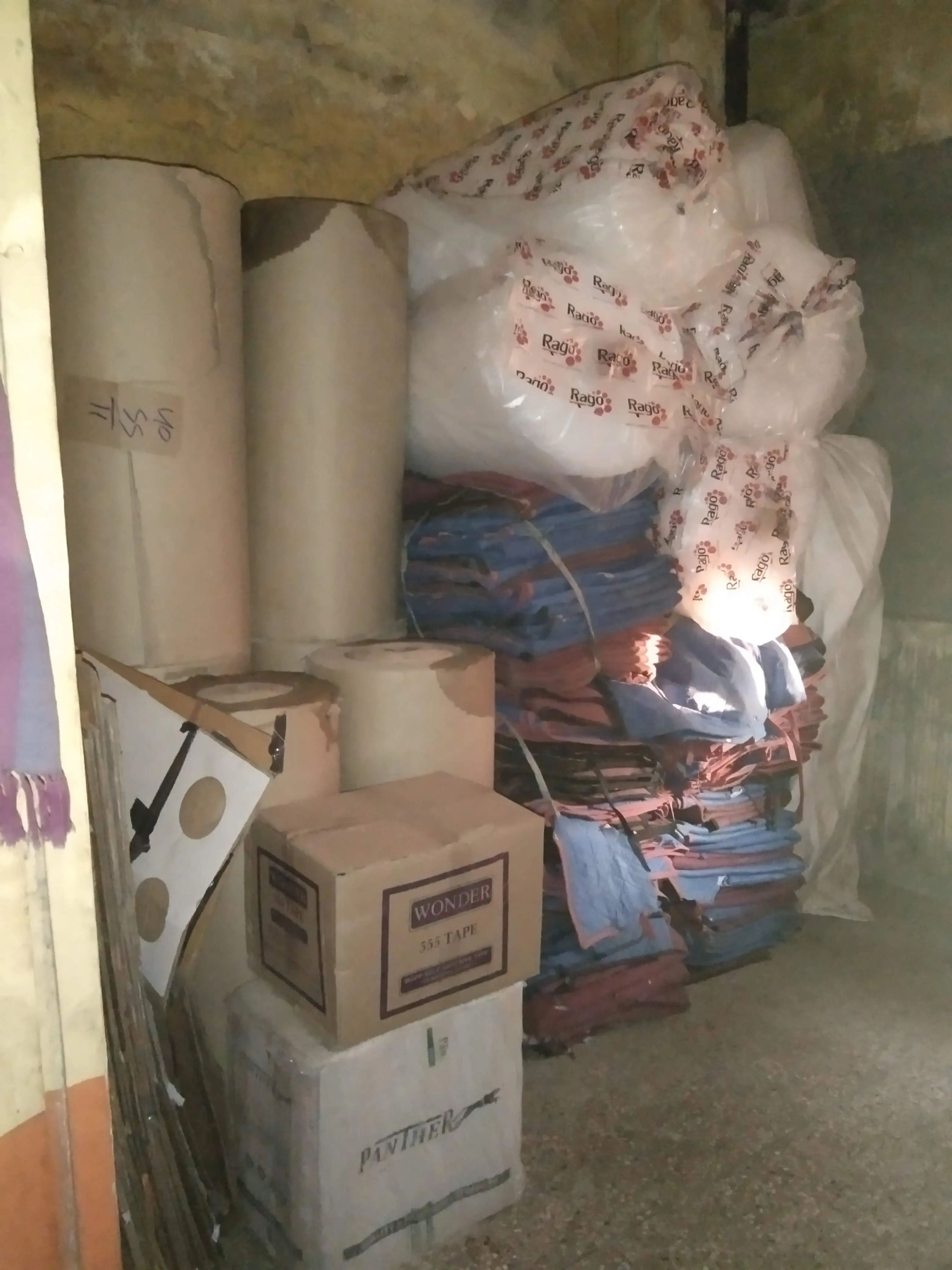 Orange Logistics Packers & Movers crew packing boxes